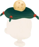 丸い卵が乗った緑色の座布団