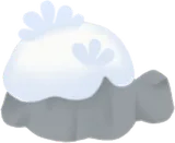 雪が積もった岩