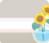 ひまわりを生けたフラスコ型花瓶