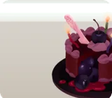 ろうそくを立てたチェリーケーキ