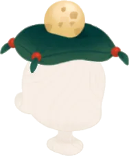 丸い卵が乗った緑色の座布団の画像