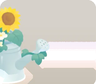 お花を生けたジョウロの画像