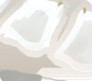 風になびいたシーツの画像