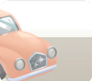 街中にあるピンクの車の画像