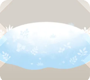 小さな植物の生えた雪の小山の画像