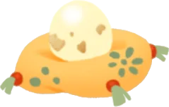 小さな卵が乗った黄色い座布団の画像