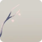 雪の結晶飾りが吊るされた枝・左